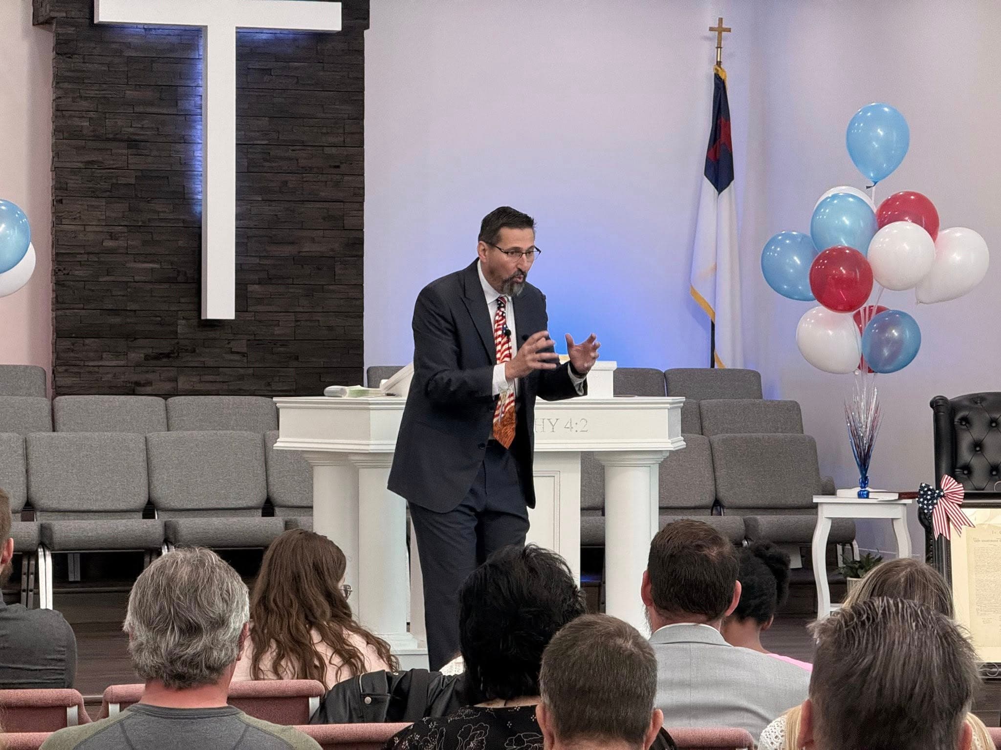 Pastor Nathan Noyes preaching at Gethsemane Church in Pekin Illinois